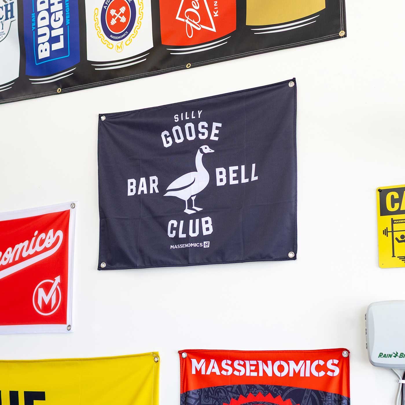 silly goose barbell club flag on wall