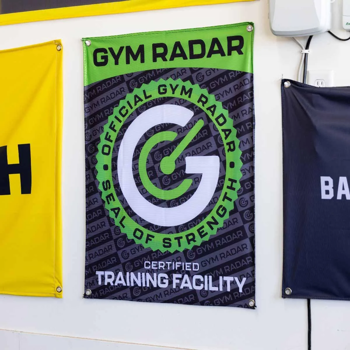 gym radar certified flag on wall