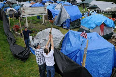 Camp Unity Eastside: Permitted Sleep and Service Hub on private land (church property) in Woodinville, WA State Ordinance: A 2010 Washington state ordinance allows for temporary encampments on church property and limits permit fees to the cost associated with review and approval. City Ordinance: A 2004 ordinance of the City of Woodinville reaffirmed the city manager’s authority to negotiate and execute an agreement for the location of a temporary homeless encampment on certain city-owned property, declaring an emergency, and allowing for immediate effect.