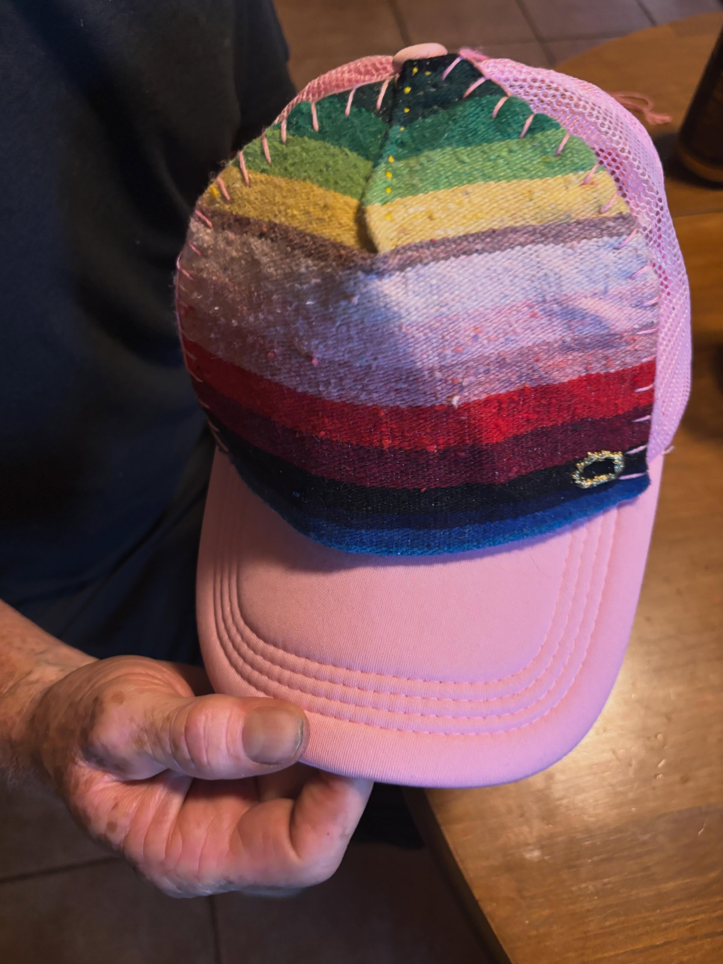 Innovate for the greater good!

Another halo hat&mdash;This time prepped by our formerly homeless facilitator Melinda, and she instructed a participant on how to finish the hat with a blanket stitch. 

Melinda had a breakthrough on how to attach the 