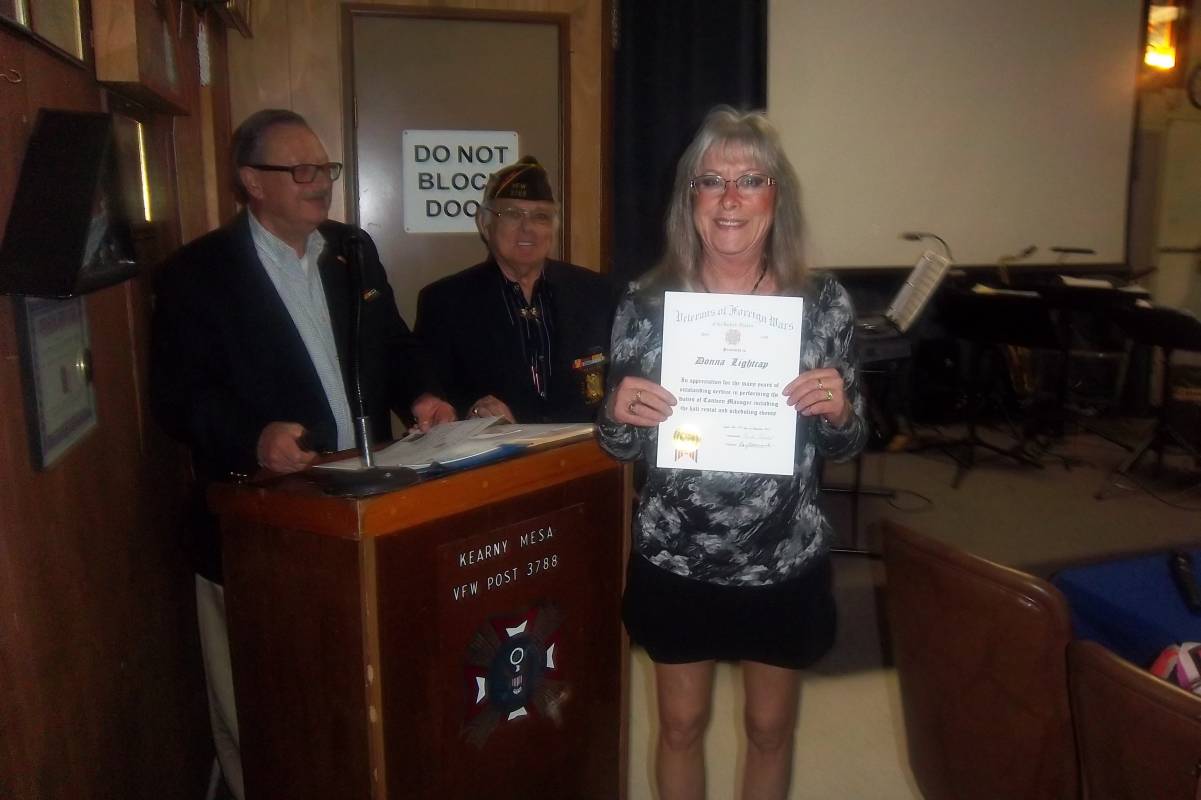 Donna Lightcap receiving a certificate.jpg