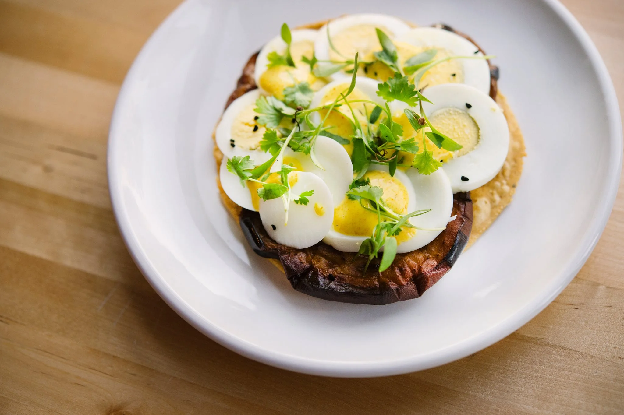 "Sour" by Chef Einat Admony- Sabich Tostada with Eggplant, Egg, and Amba Aioli.
