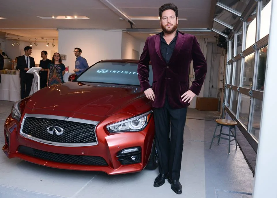 MOFAD Lab Opening Gala host Chef Scott Conant poses by the Infiniti Q50 %22Driven by the Senses%22 simulator. .jpg