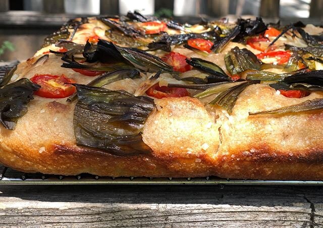 Walk the street with Ramps and tomato focaccia, slice $5.00 get your slice before it flies out seriously