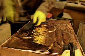 Artisans at D'Oro, purveyor of find gold books in Rome. 