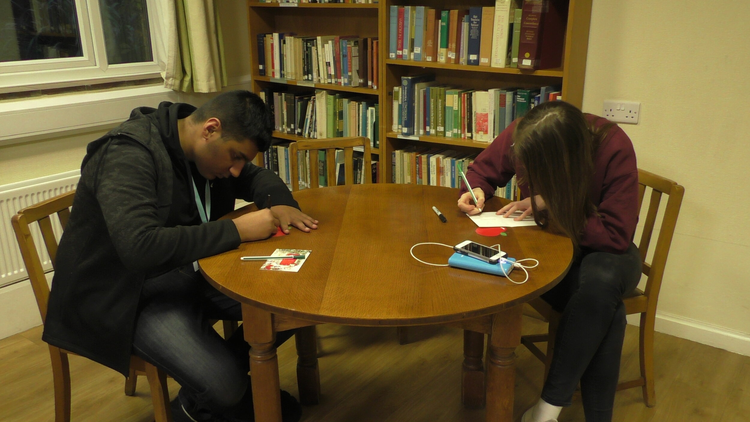 Mohammed and Kate writing cards.JPG