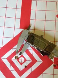 First 5 shot group with Berger 140 hybrids in one hole. the low right hit was the last 140 target vld.