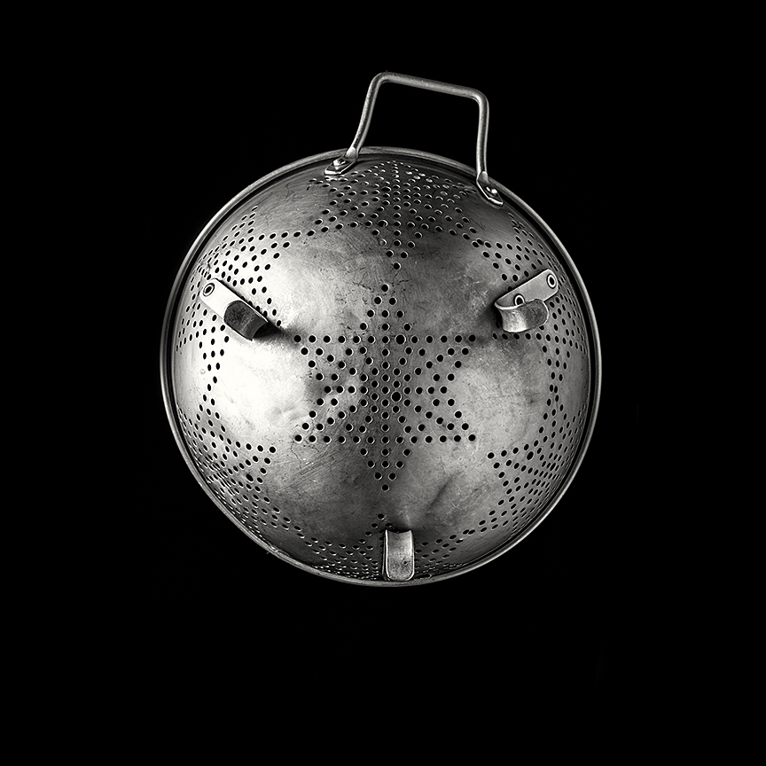 Colander - This has been in my kitchen for as long as I can remember. The other handle came off in an over zealous bought of stock making.