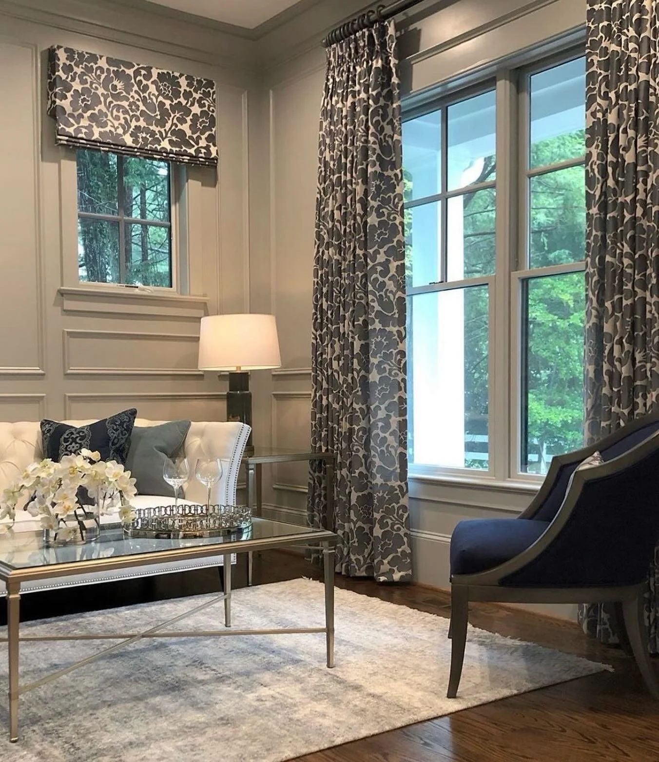 Revisiting an old favorite because some rooms are worth sharing twice. I love how the detailed paneling, layered window treatments, and mix of classic silhouettes give this living room a polished but welcoming feel. Timeless, collected, and never too