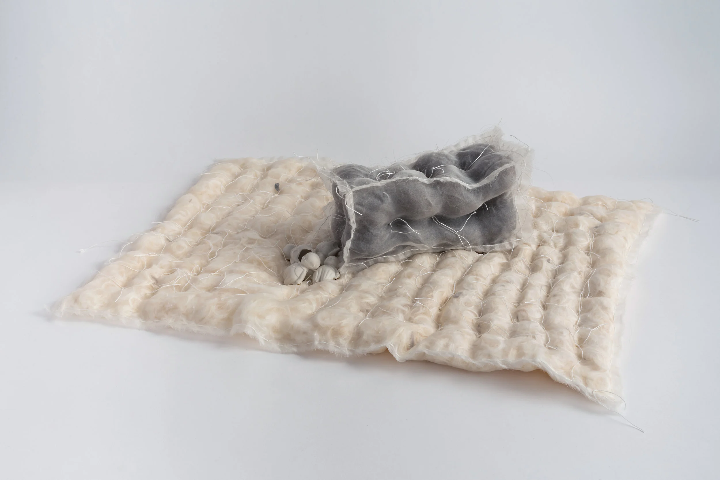   It Comes from Us , 2017, silk, hair, feathers, porcelain; photo by Mario Galluci. 