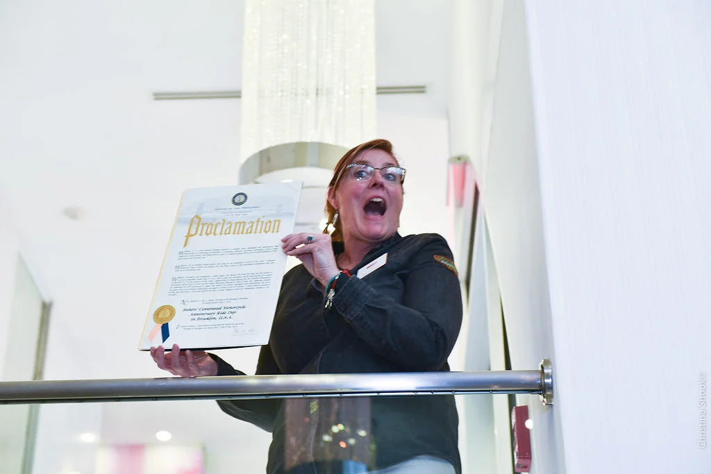 Alisa Clickenger (organizer) holds the Proclamation (Photo: Christina Shook)