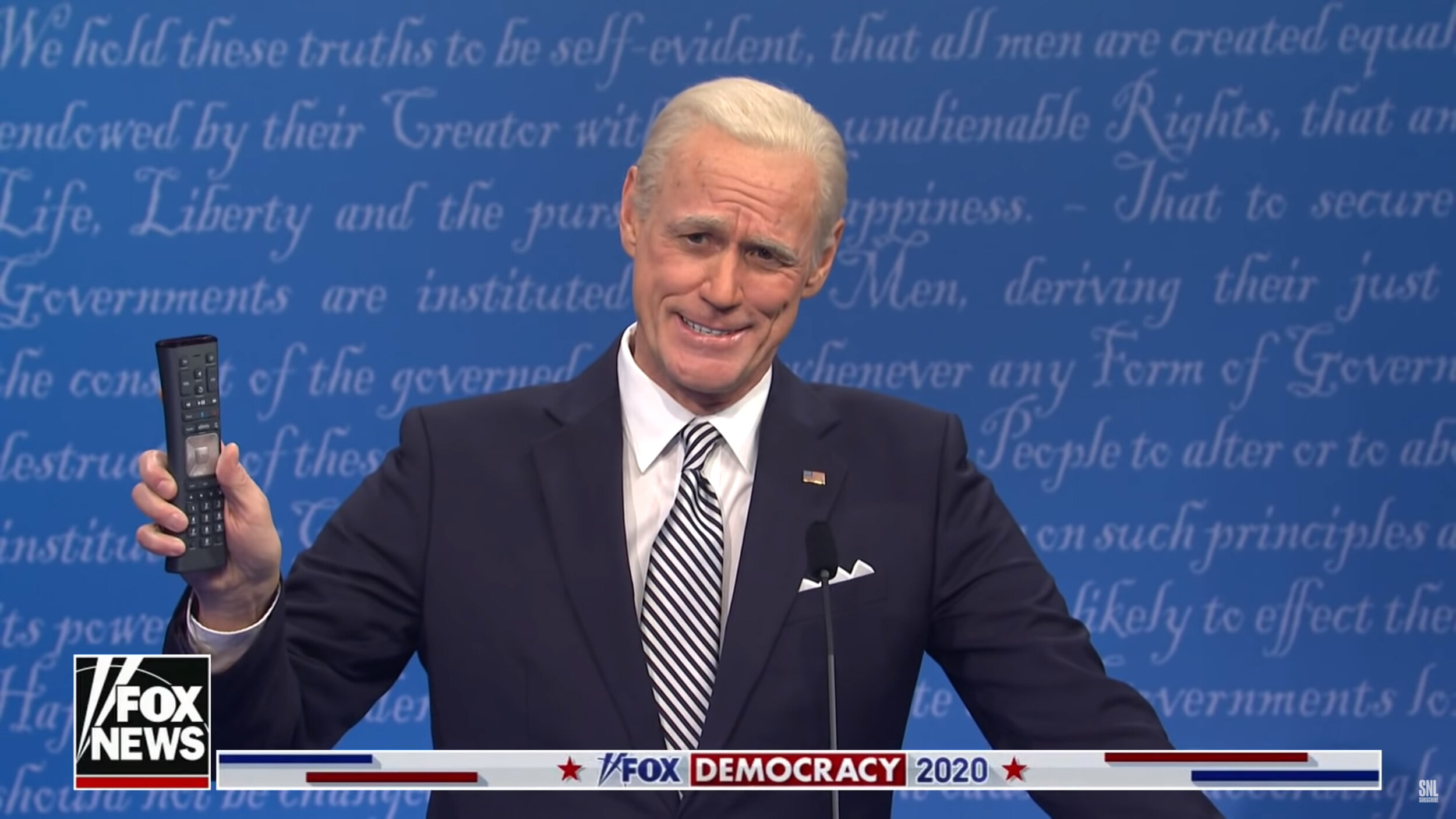 Comcast Remote being held by Jim Carrey/Joe Biden on Saturday Night Live.