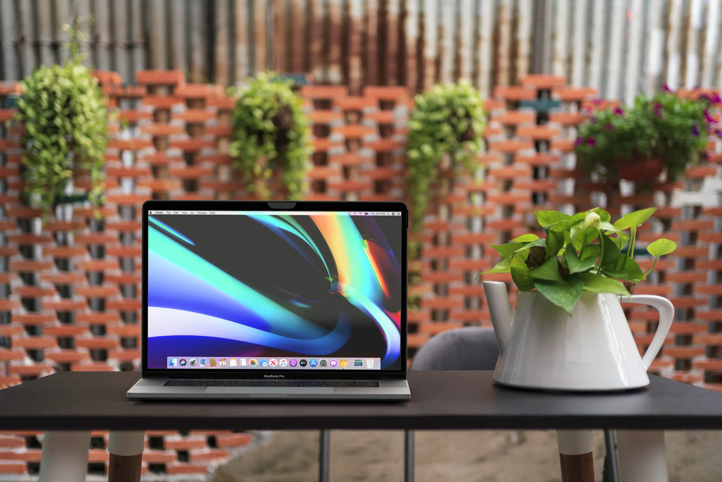 After : Rendered in 3D, current Macbook, matched lighting, shading, shadow + reflections. Added Privacy screen.