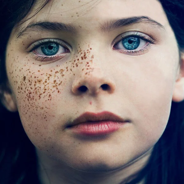 Freckles removed. Eye shaped warped,  Eye, Eyebrow and stray hairs cleaned.