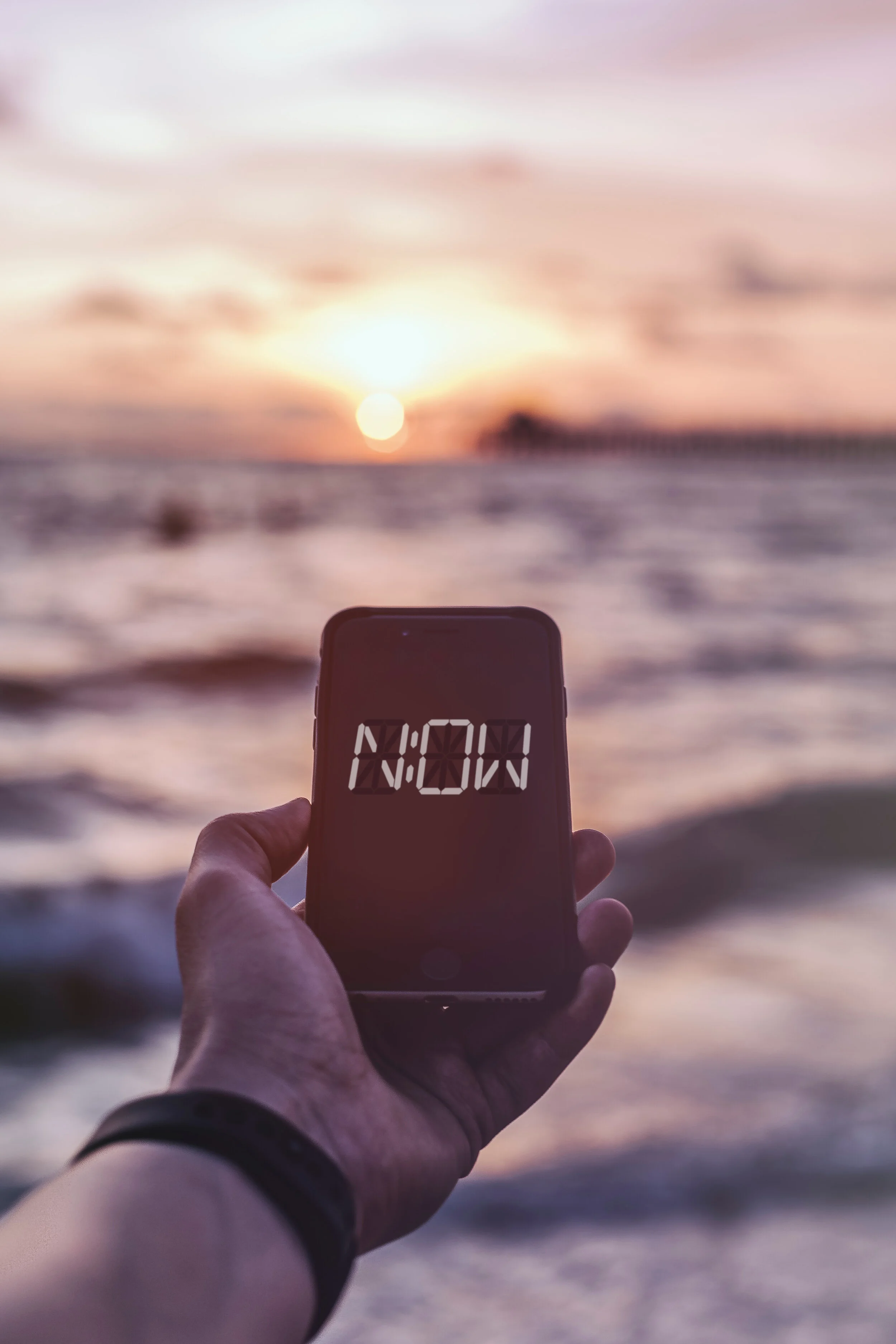 Holding iPhone NOW graphic.jpg