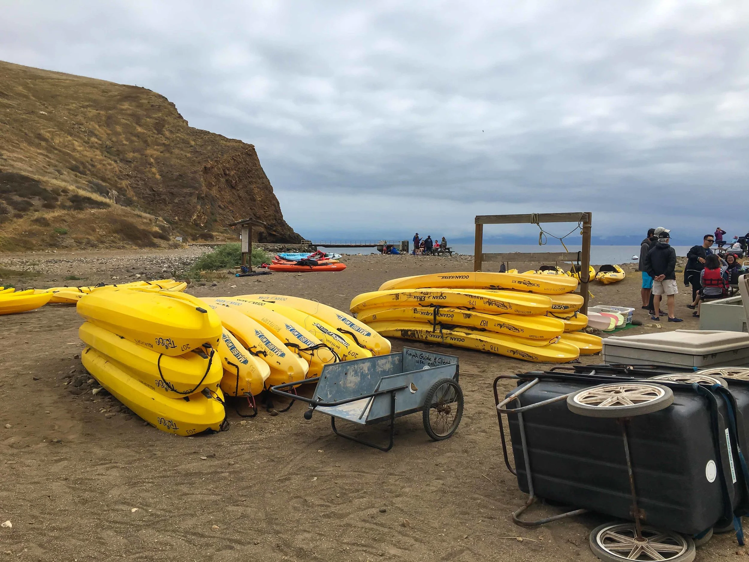 Sea kyacks awaiting bold trips with the Santa Barbara Adventure Company, on Santa Cruz Island. Photo by Derek Wright.