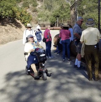 Laura L Mays Hoopes on a Sierra Club hike with her scooter, at the Hollywood Reservoir.