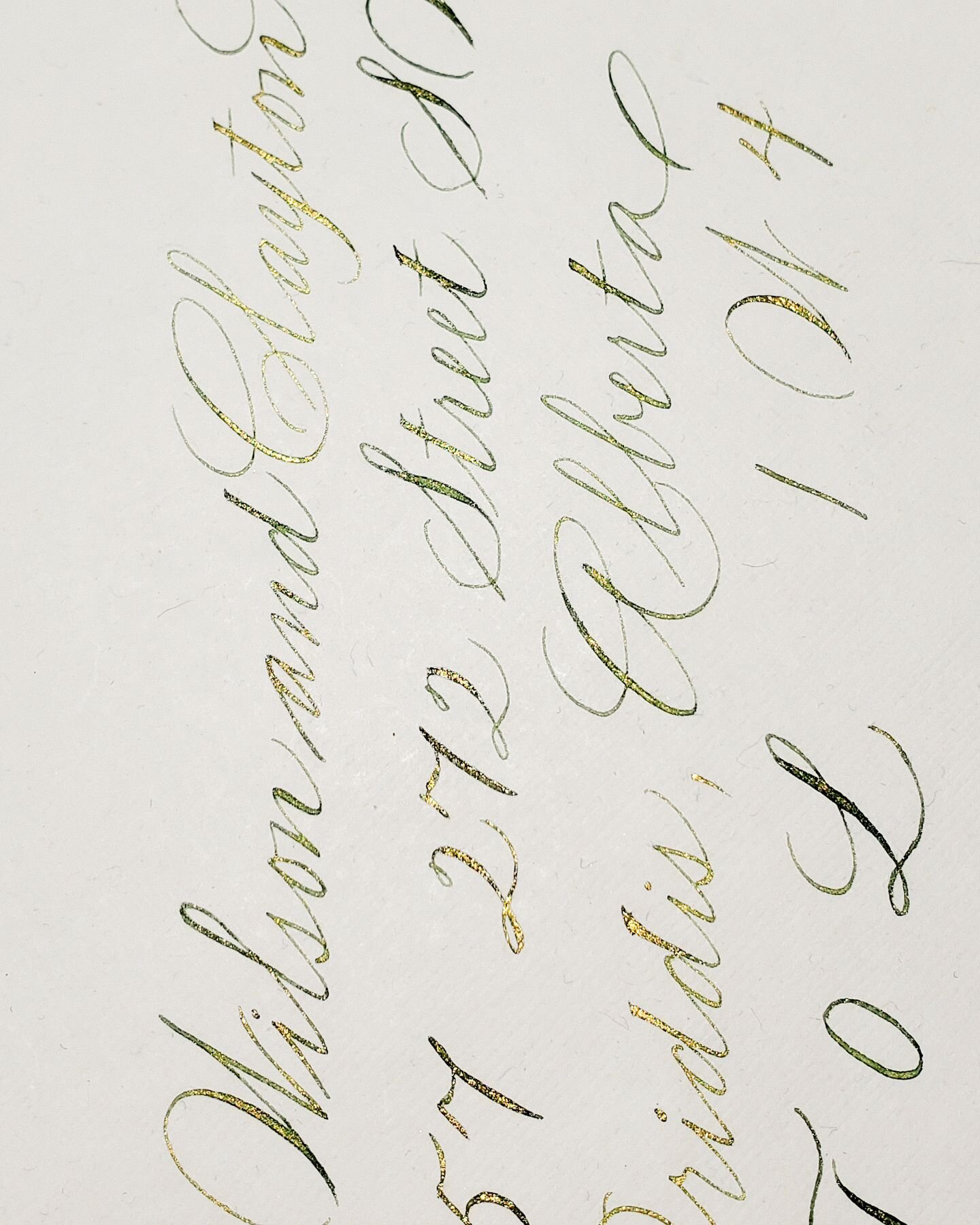 Custom duo colored ink that looks like a dark green at first glance but turns gold when the envelope is tilted ever so slightly. Something guests will notice because you won't find this kind of duo colored ink on regular digital address printing. 

#