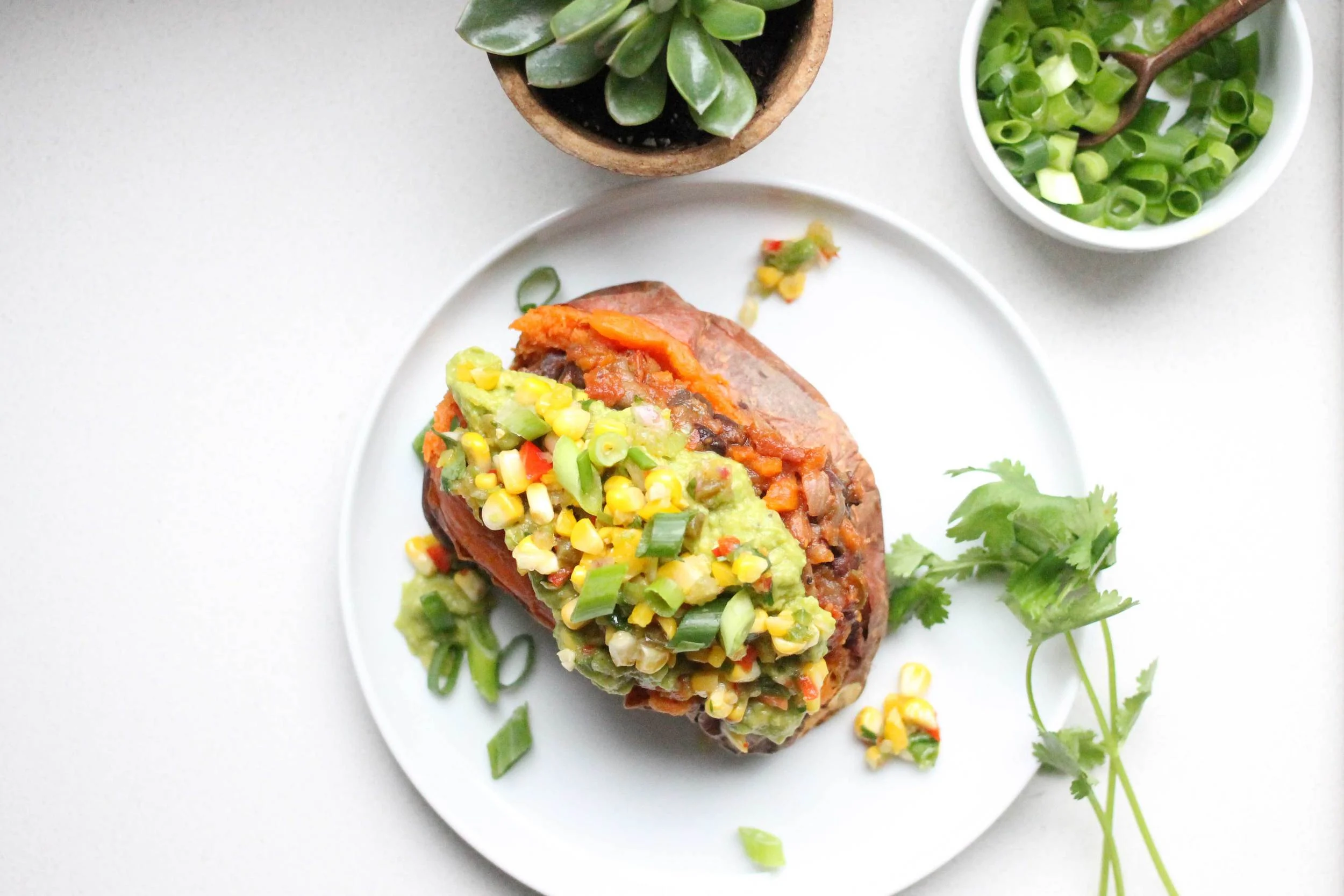 Baked Sweet Potatoes Stuffed with Black Bean Chili topped with Grilled Corn Salsa