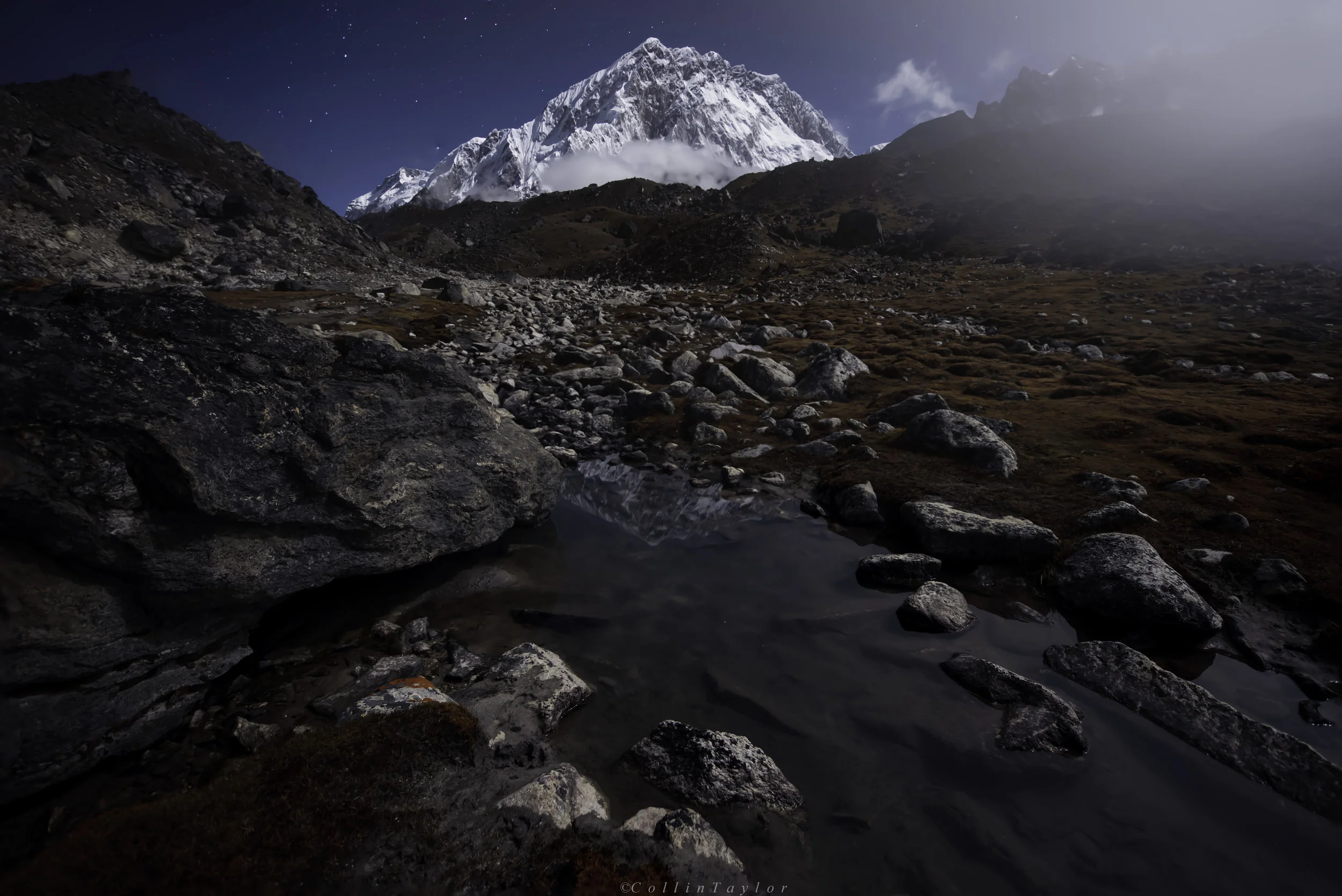 Reflection of Lhotse as the fog quickly rolls in at 16,200ft - Lobuche, Nepal