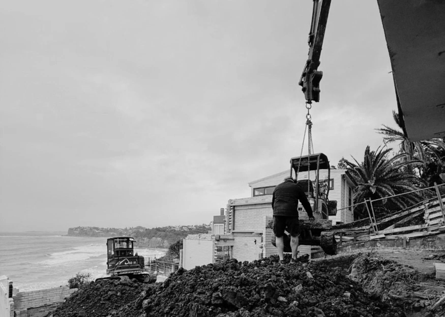 Construction begins on the Bilgola Beach House as excavators prepare the steep coastal site overlooking Bilgola Beach on Sydney's Northern Beaches.