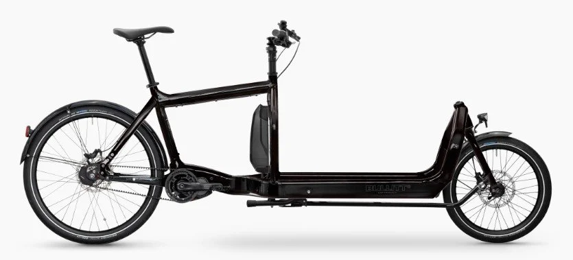 Electric bicycle with a black frame and a long, low design, featuring two large wheels and a battery pack mounted on the frame.