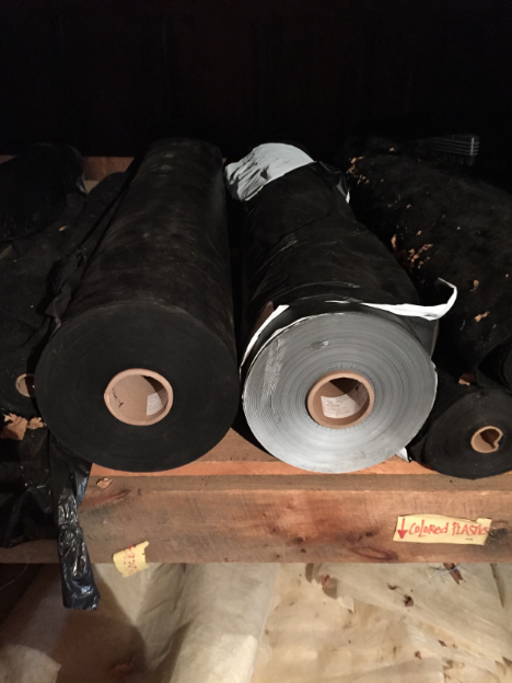 Black and white-on-black plastic mulch rolls waiting for their day!