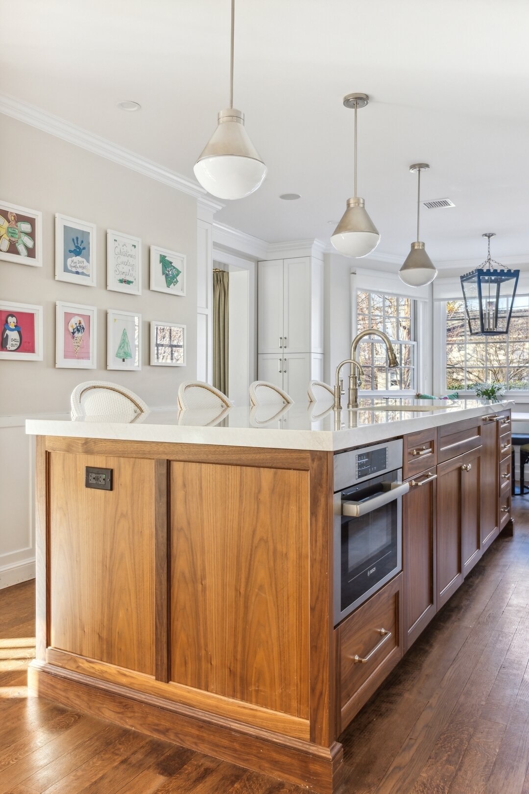 More from this gorgeous family kitchen.  Adore how the walnut island warms up the white cabinetry.  As well as the rotating gallery wall of kids artwork!  #CSDathome
.
.
.
.
.
#dreamkitchen
#kitchengoals
#familykitchen
#familyhome
#longislandinterior