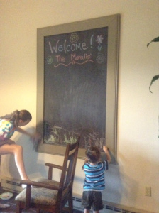 The kids enjoying a chalkboard project I worked on with my dad.