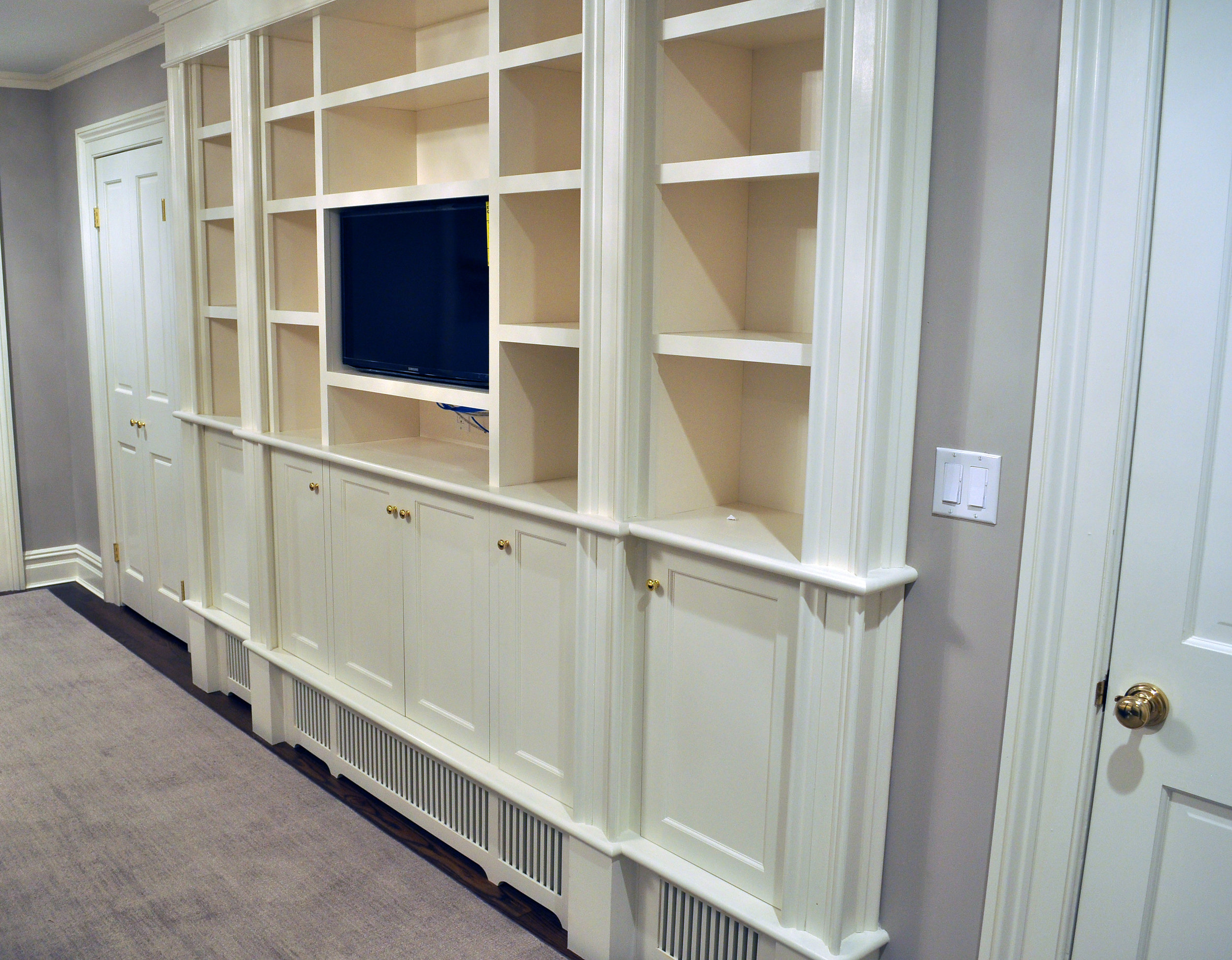 Custom design built-in bedroom storage with bookshelf. 