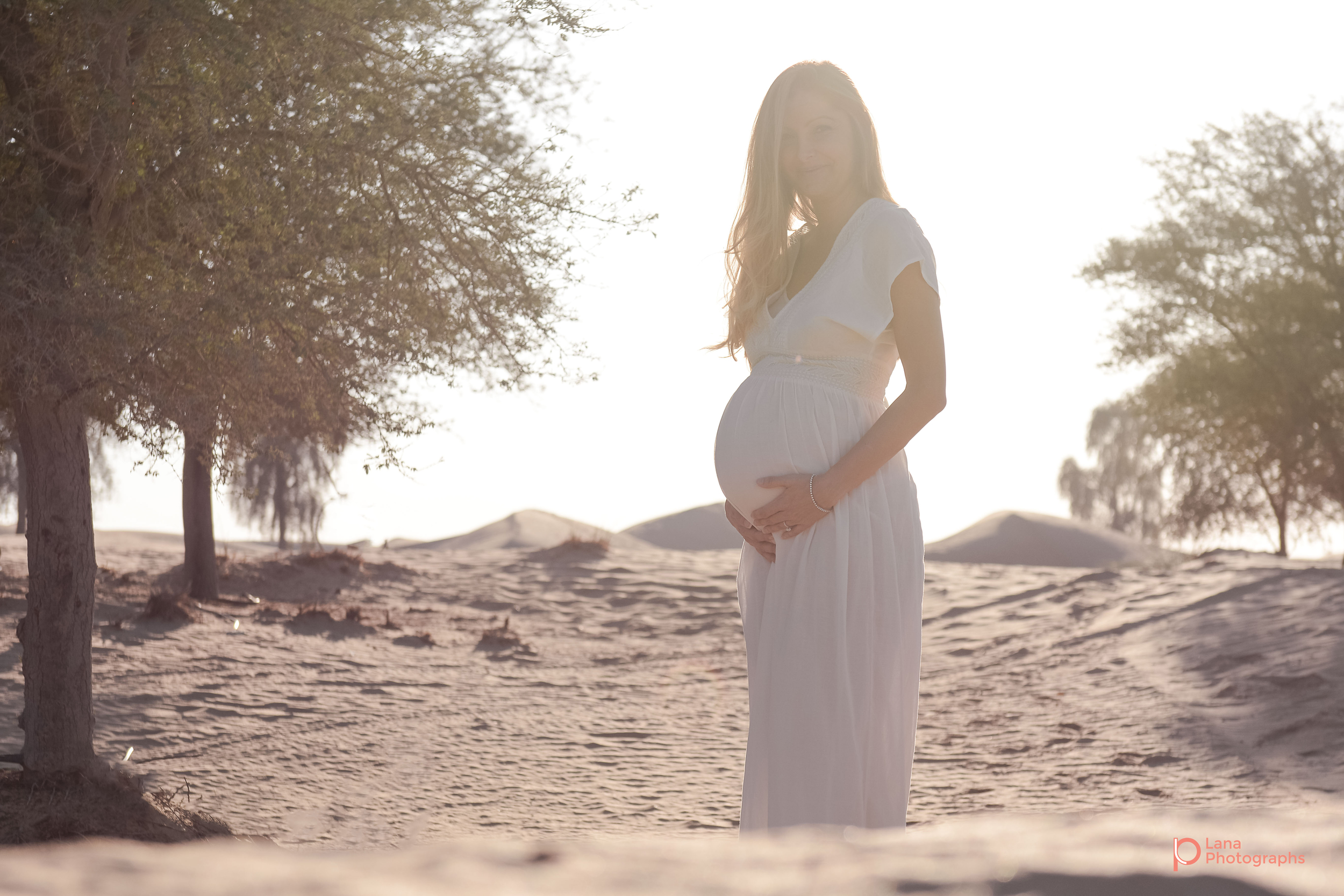 Dubai Maternity Photography portrait of pregnant woman posing in the sun
