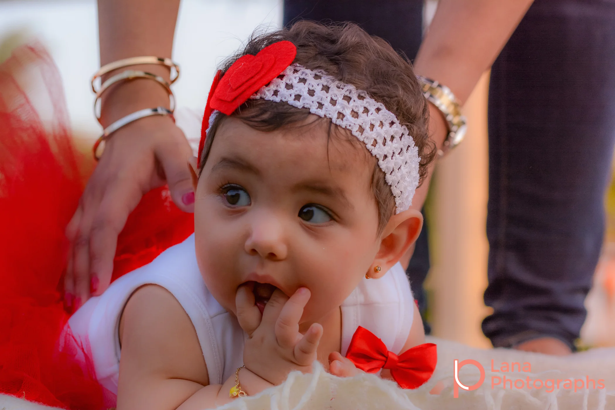 Dubai Family Photography portrait of a little baby girl in red tutu in the park