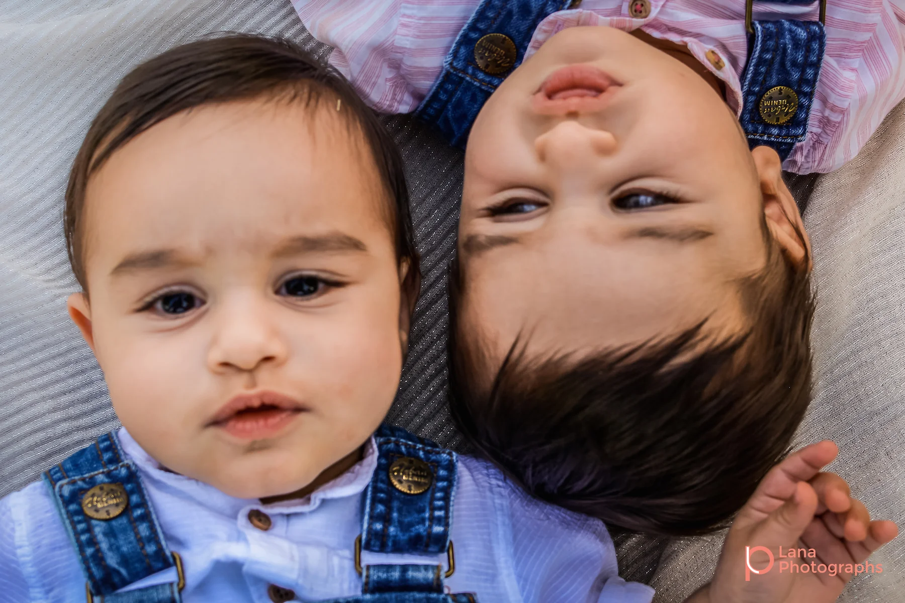 Dubai Family Photography twins posing on the grass