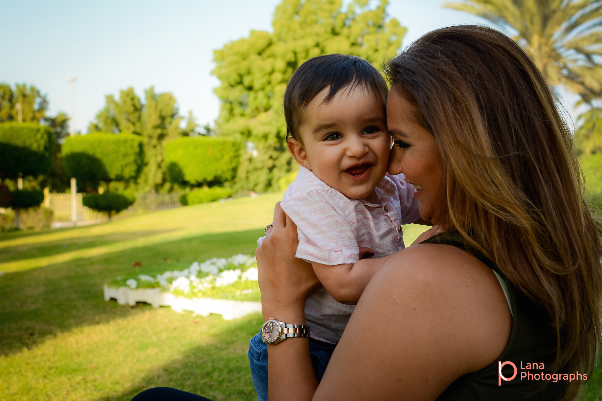 Dubai Family Photography mother cuddling her son in the park