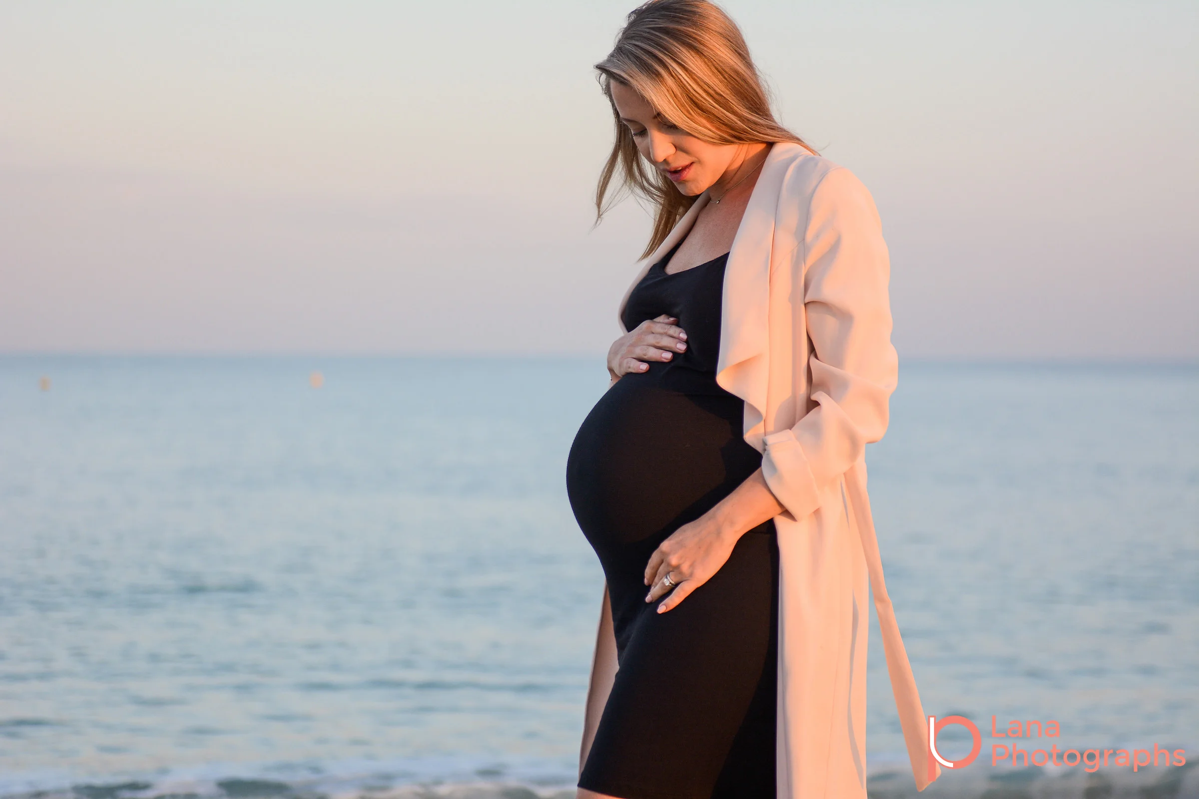 Dubai Maternity Photographer portrait of pregnant woman posing on the beach