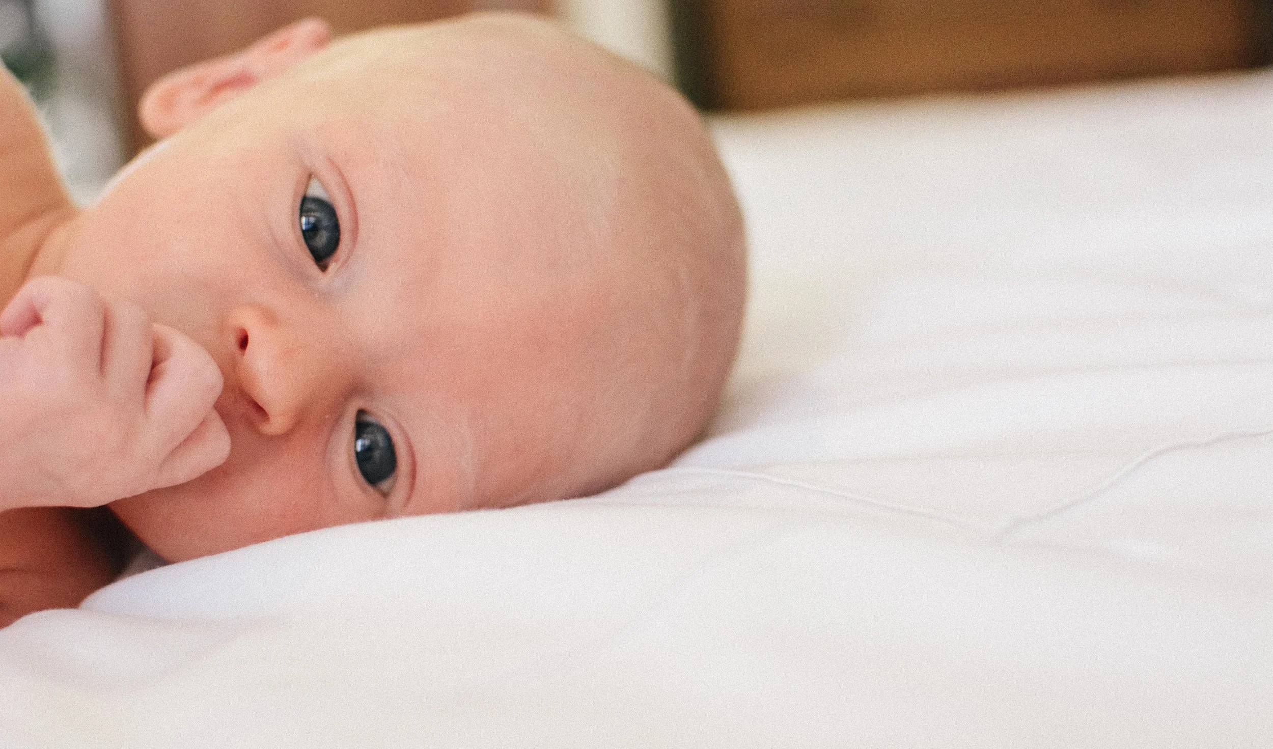 Lana Photographs Newborn Baby Photographer Newborn Photographer Dubai Professional Newborn Photography newborn baby looking at camera