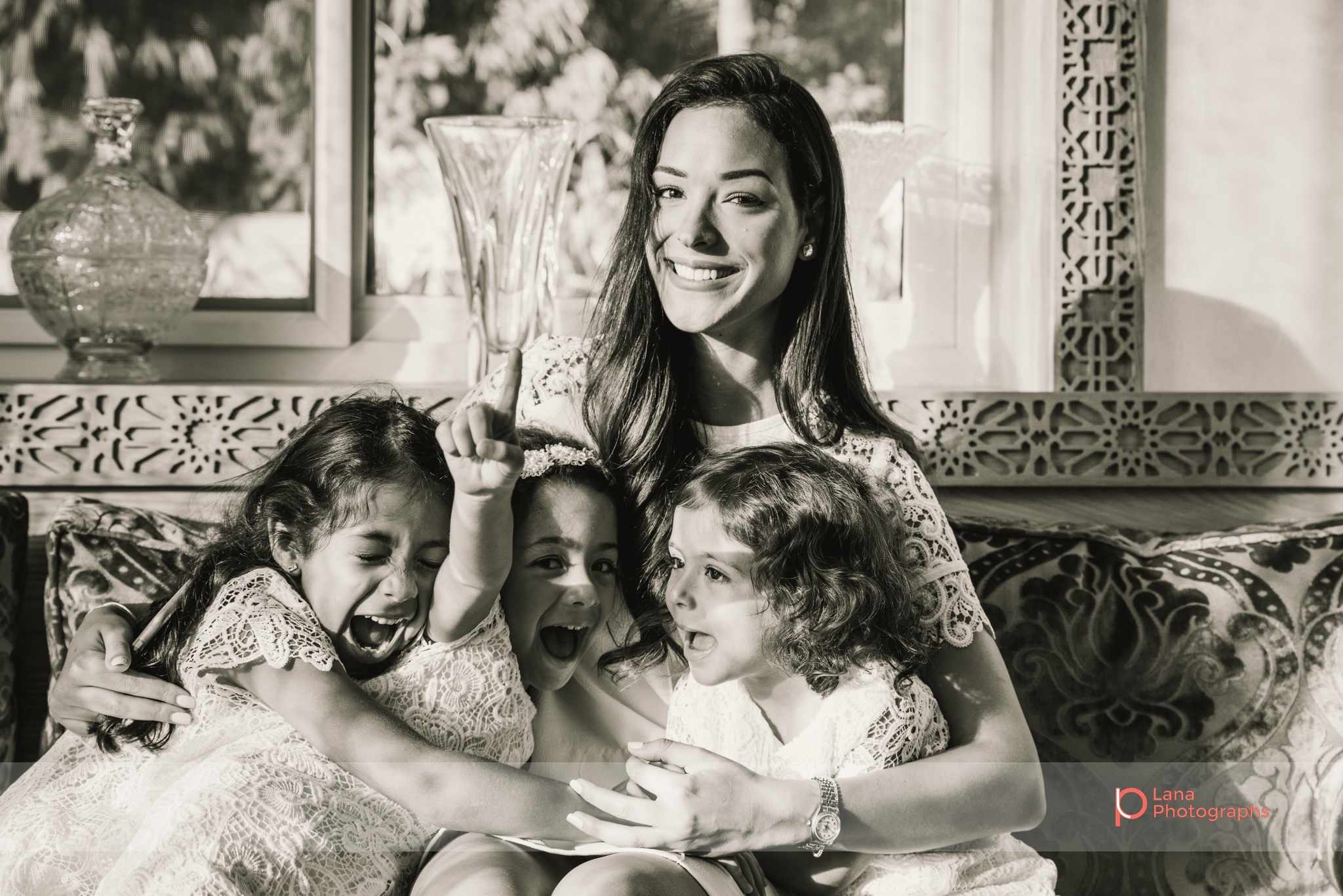 Lana Photographs Family Photographer Dubai Top Family Photographers girls hugging their mother