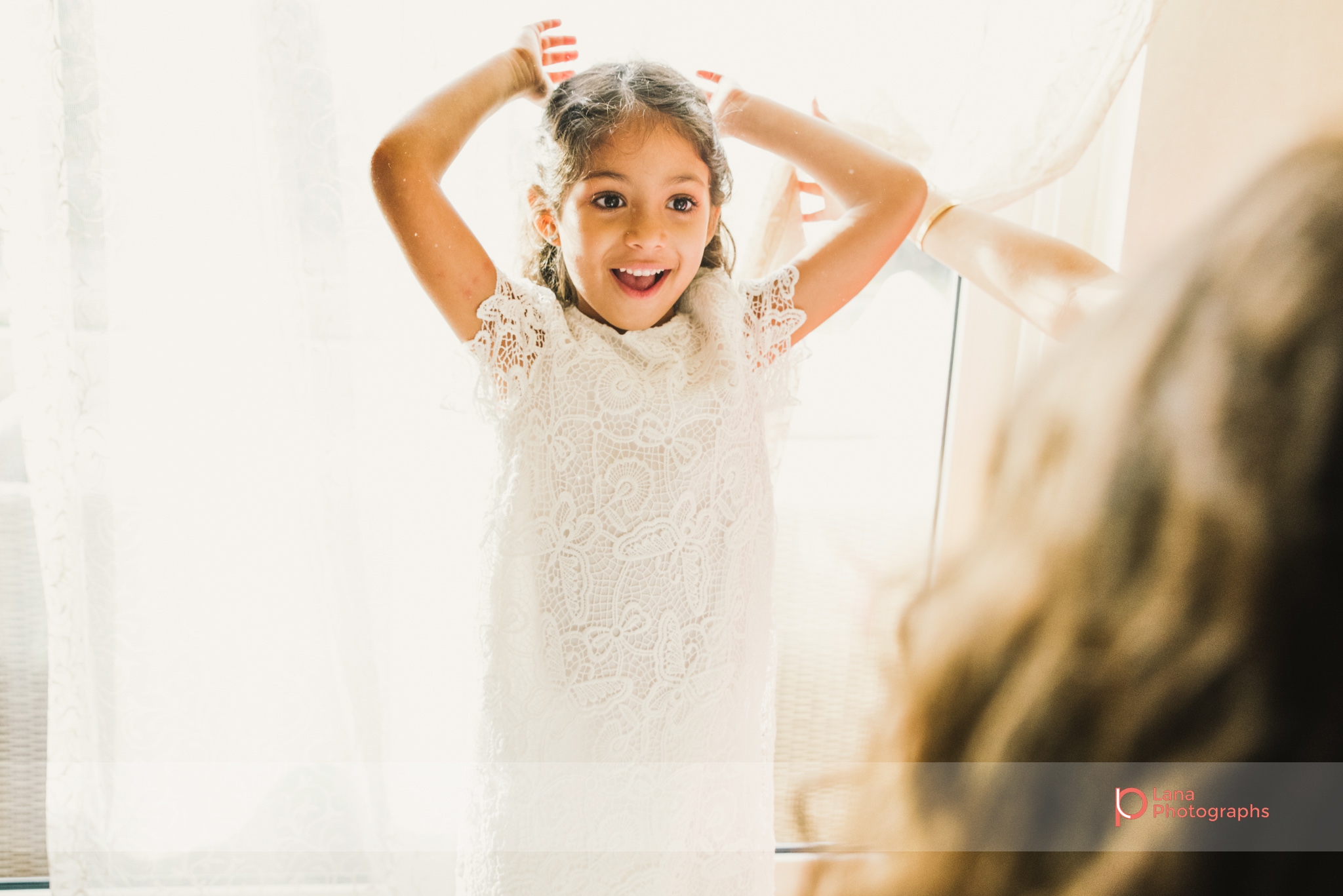 Lana Photographs Family Photographer Dubai Top Family Photographers girl playing by the curtains