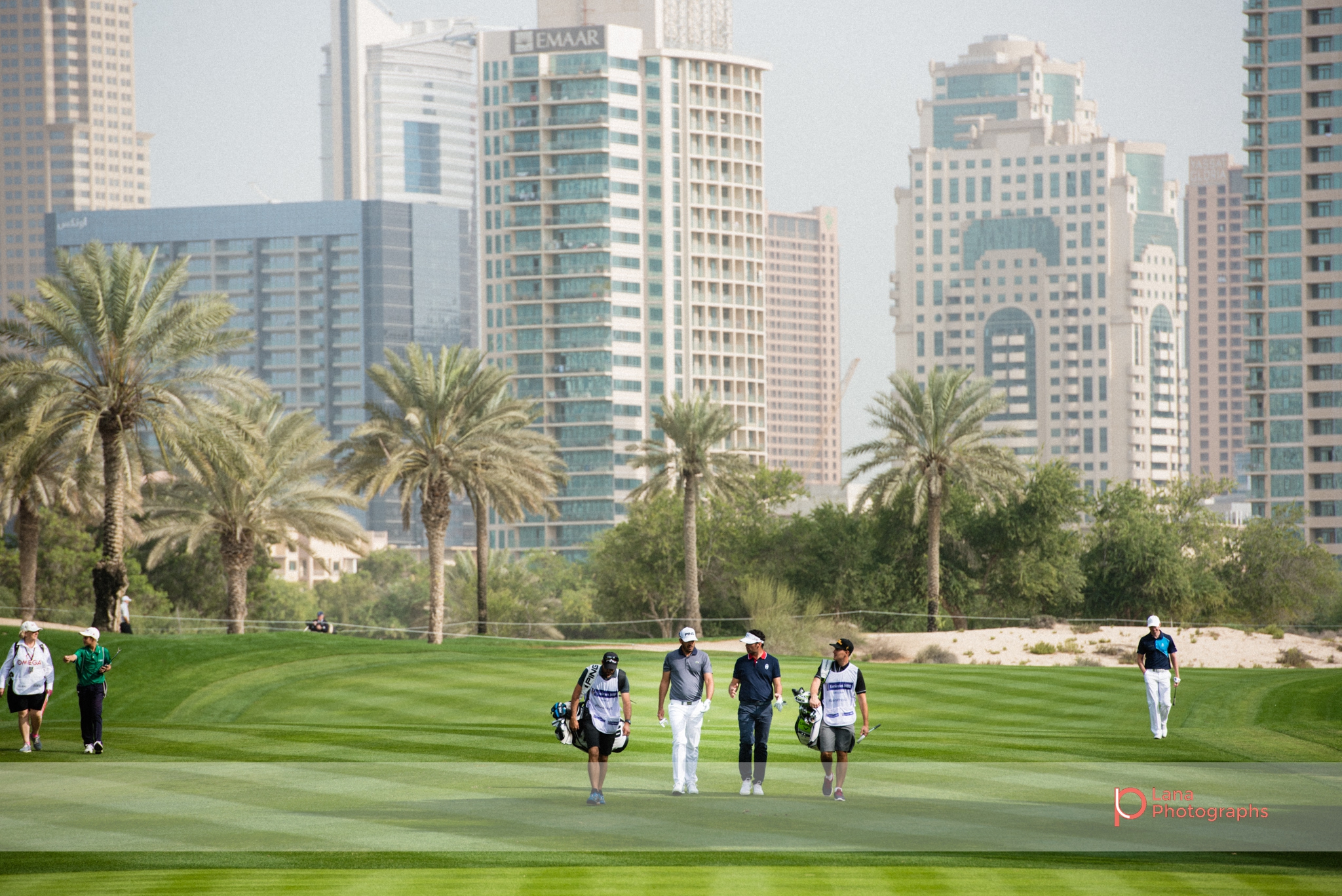  European PGA tour players walking across the Emirates Golf Course grounds during the Omega Dubai Desert Classic in Dubai February 2017 