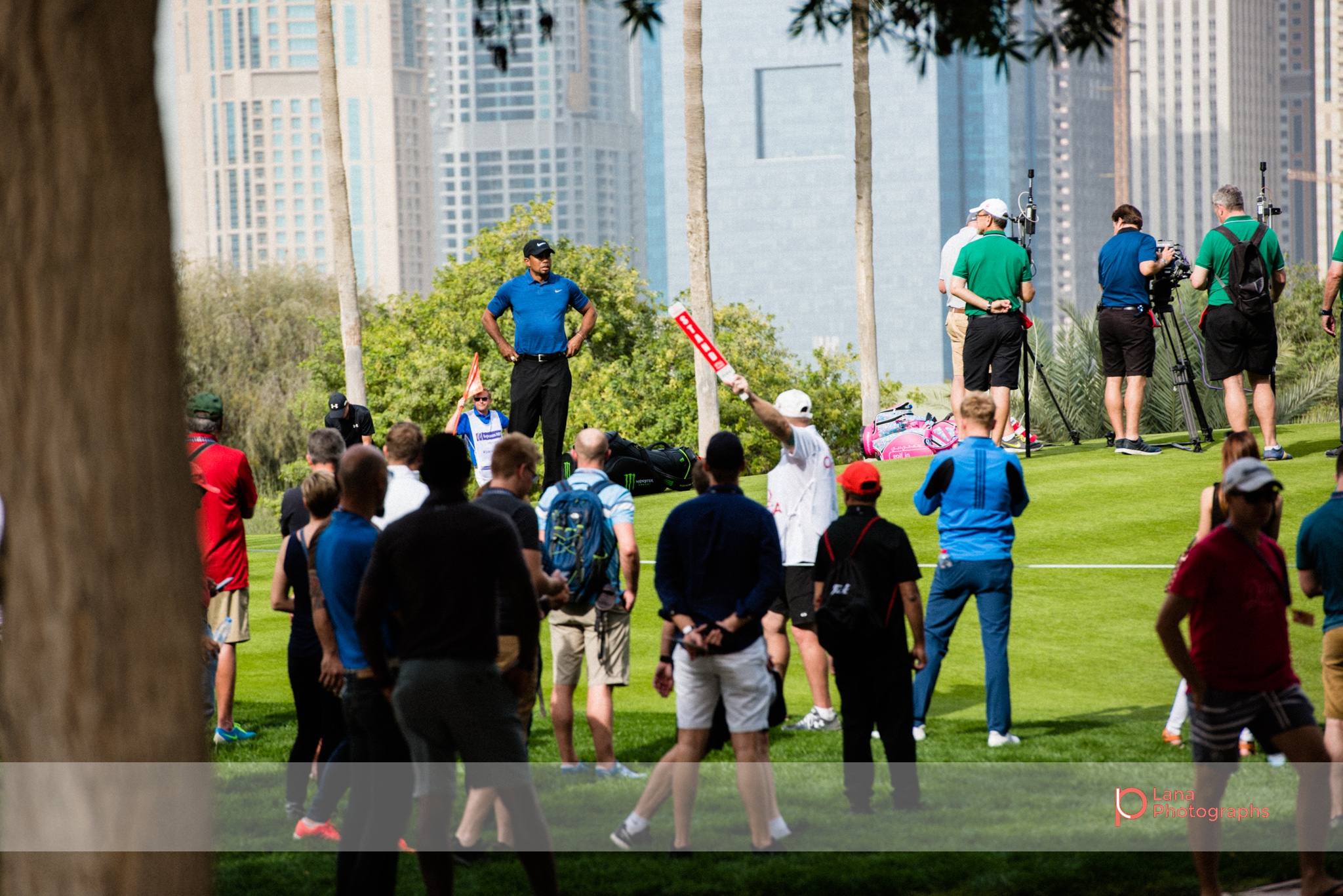  A visibly disappointed  Tiger Woods &nbsp;stands with his hands on his hips as he swings and misses during the Omega Dubai Desert Classic. Tiger Woods later went on to withdrawing from the competition before entering Round 2. 