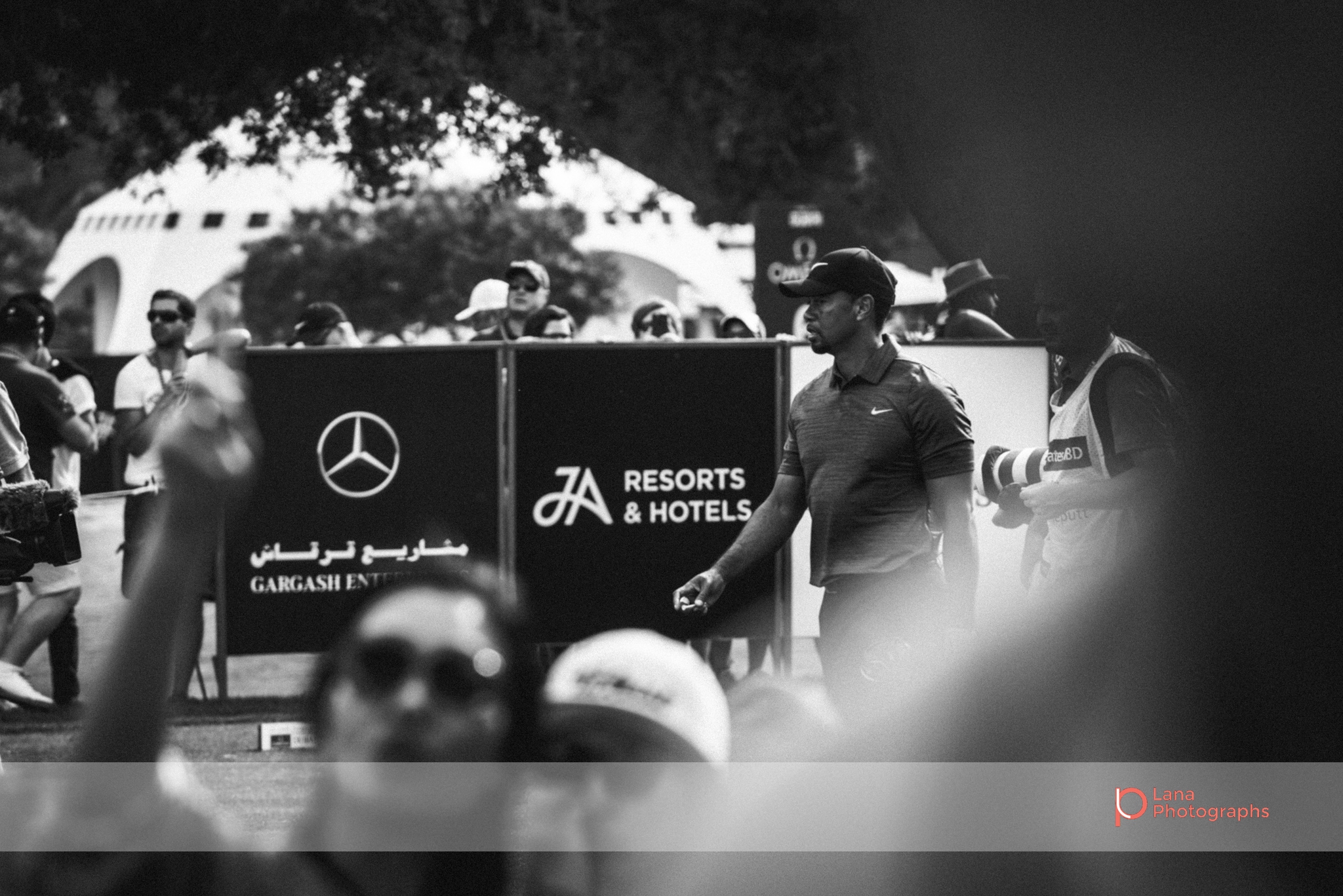 A visibly disappointed Tiger Woods walks across the Emirates Golf Course grounds during the Omega Dubai Desert Classic.