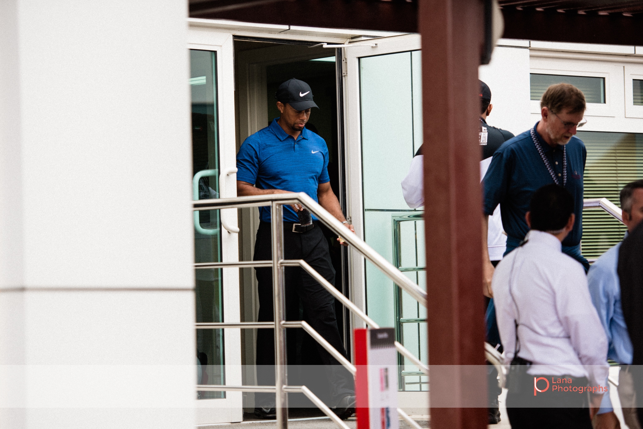 Tiger Woods leaves the organizers office during day 1 of the Omega Dubai Desert Classic in February 2017