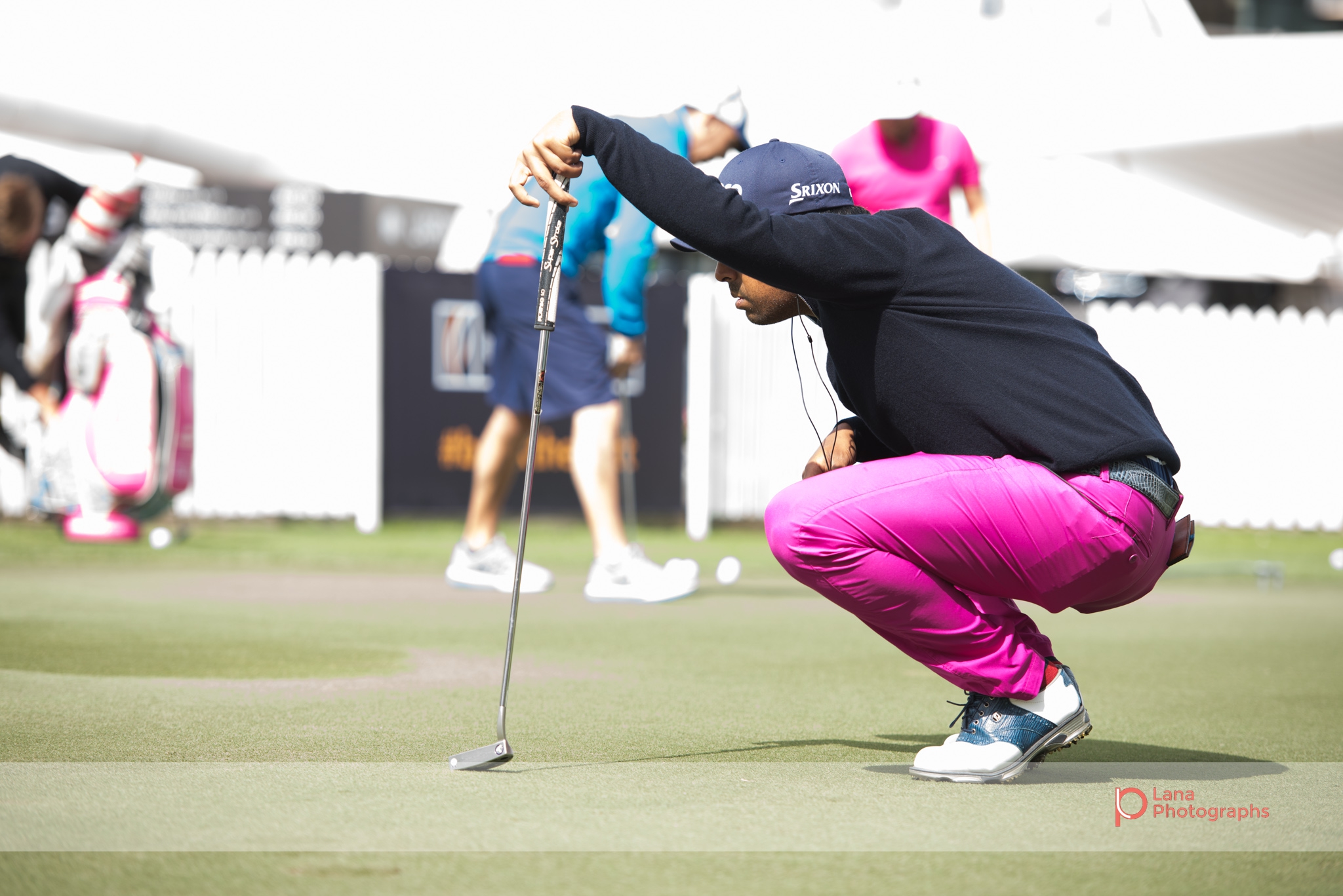 Golf player prepares to aim at the putting greens at the Omega Dubai Desert Classic in February 2017