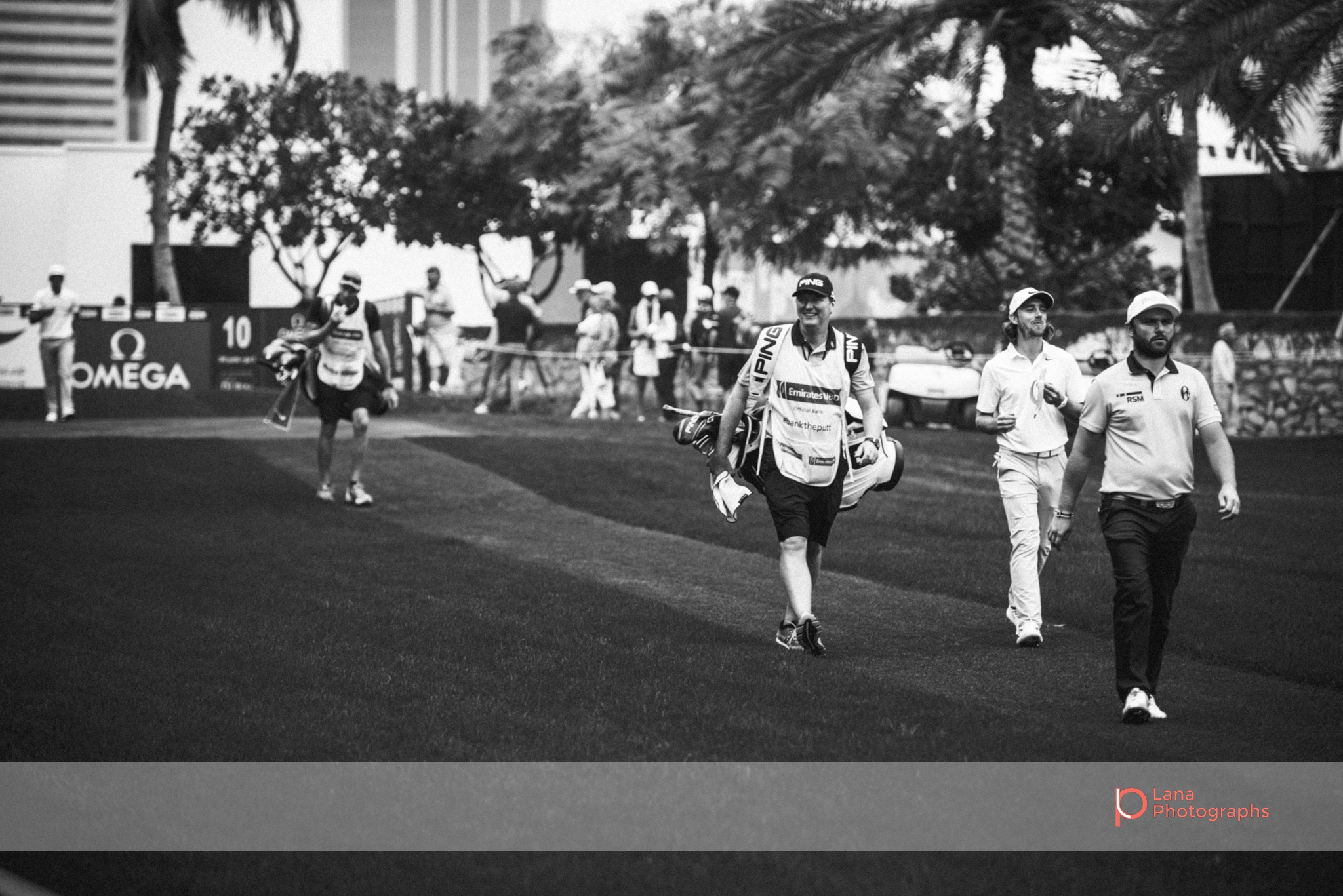 Tour players walking across the grounds at the Omega Dubai Desert Classic 