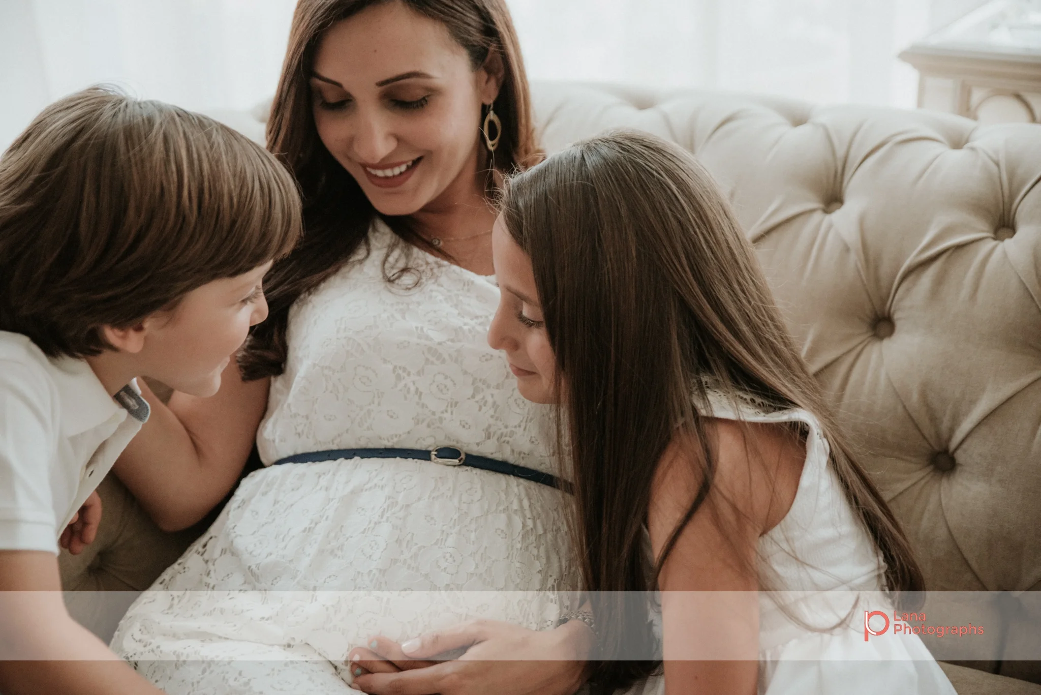 Lana Photographs Maternity Photography Dubai Professional Maternity Photographer children admiring mother's pregnant belly