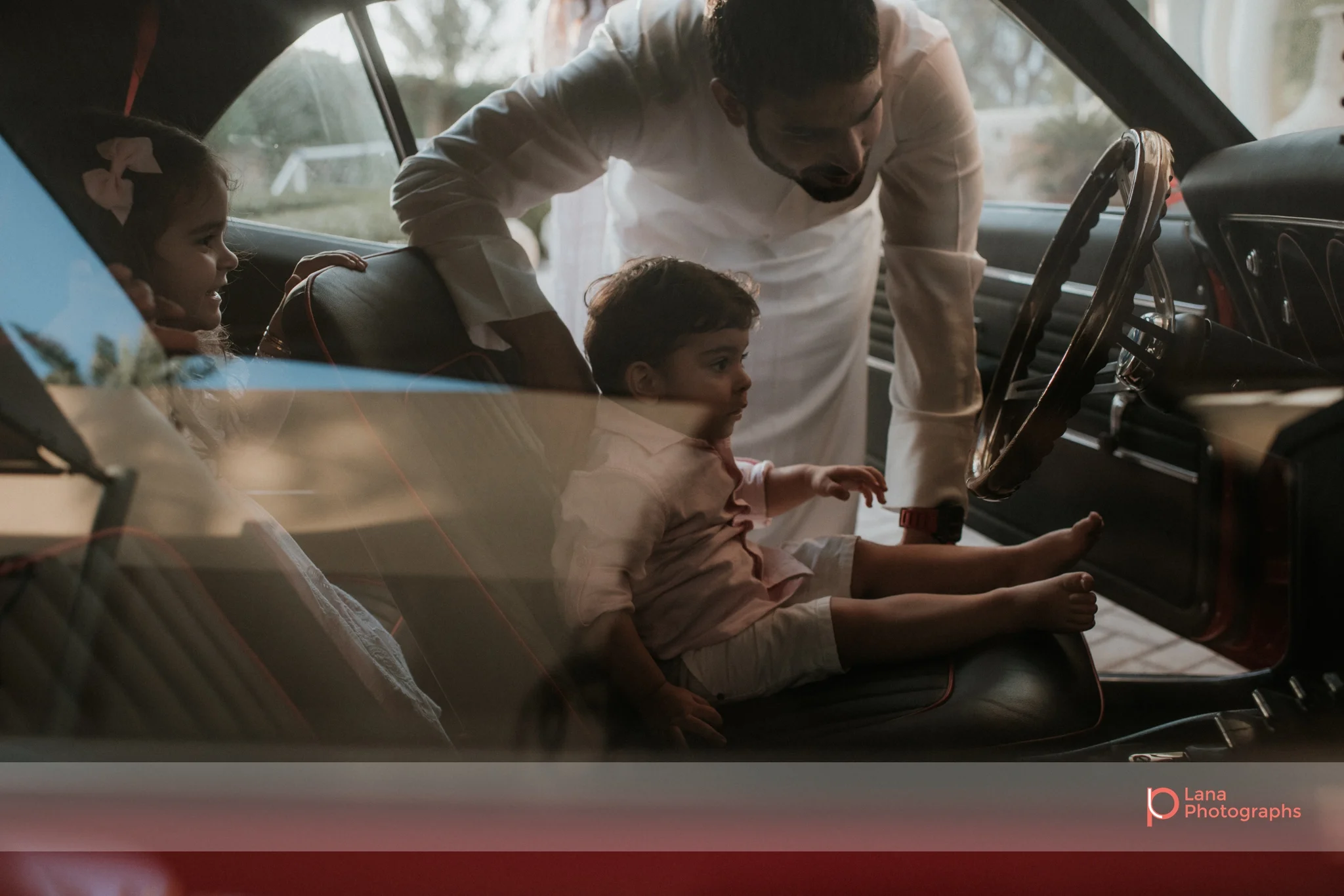 Lana Photographs Family Photographer Dubai Top Family Photographers father and son in Camaro ss68