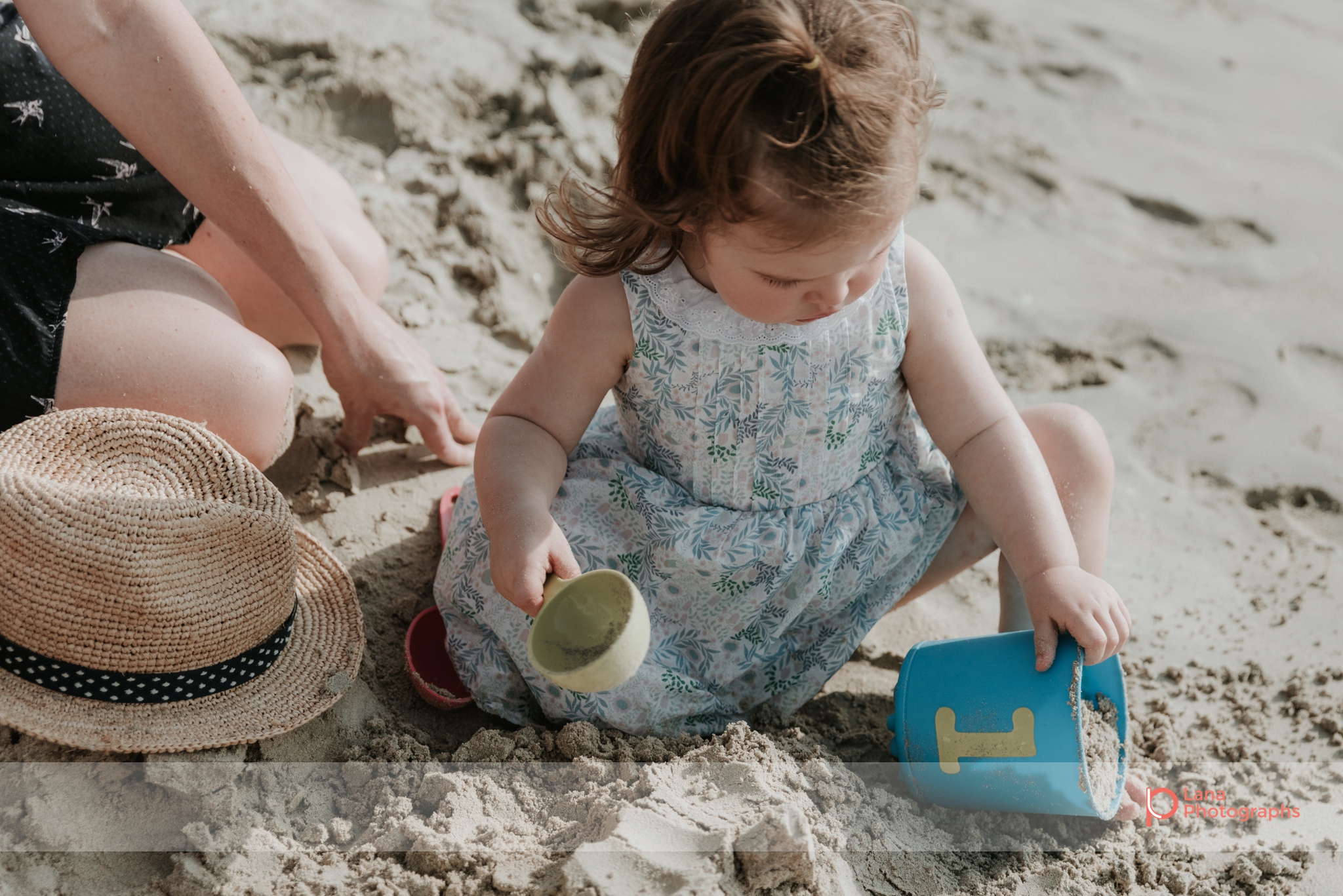 Lana Photographs Maternity Photography Dubai Professional Maternity Photographer little girl playing in the sand