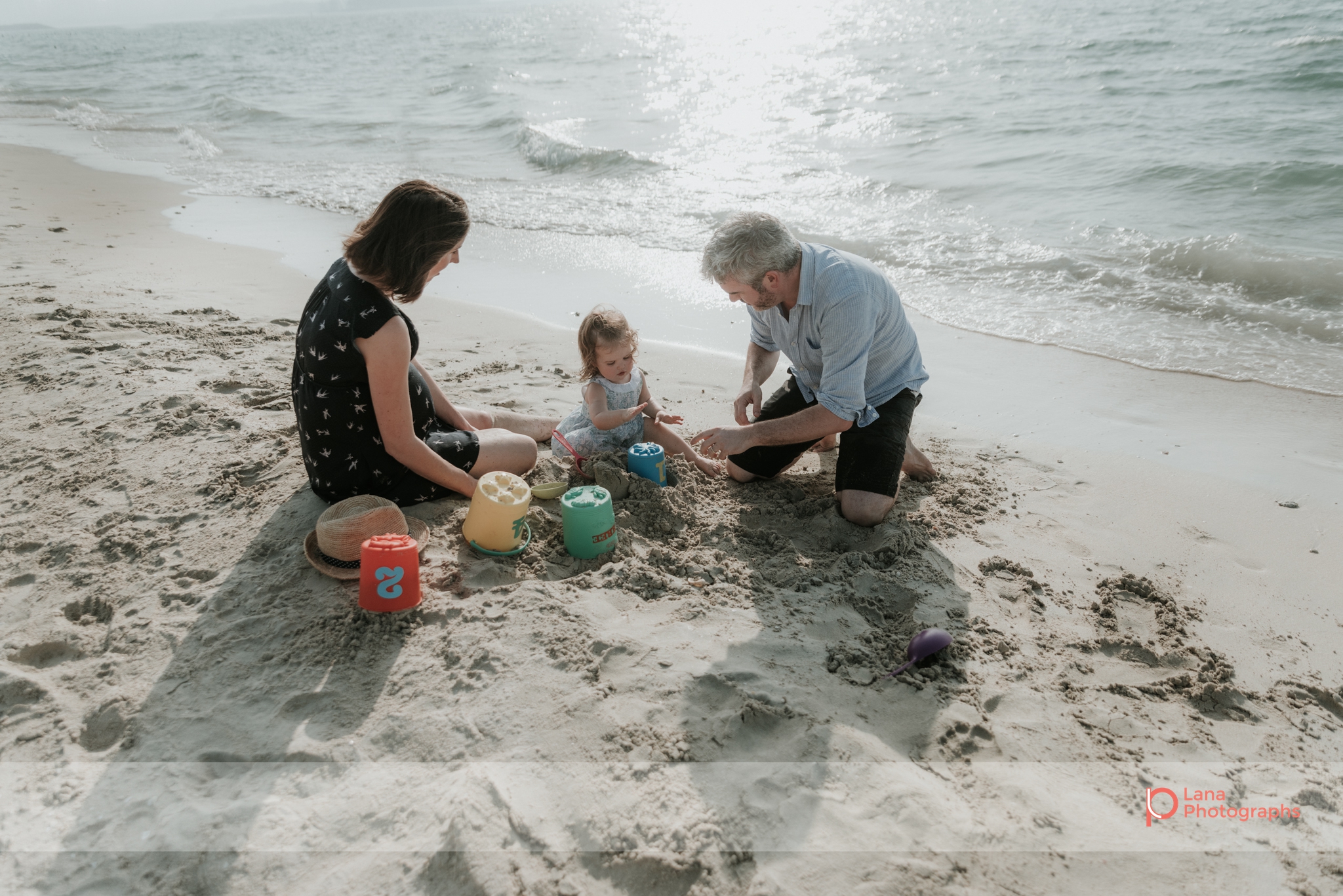 Lana Photographs Maternity Photography Dubai Professional Maternity Photographer family playing in the sand