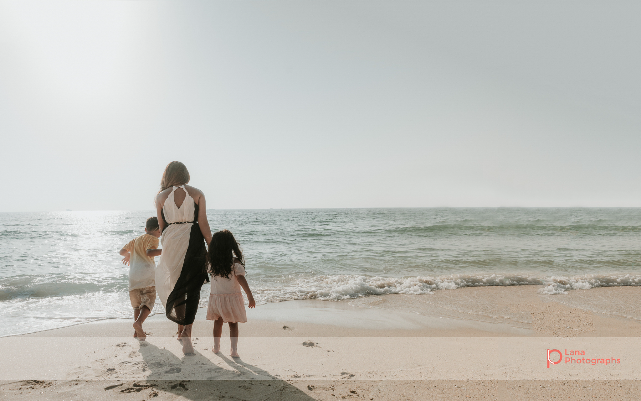  Lana Photographs Dubai Family Photography beach photoshoot family shot on the shore 