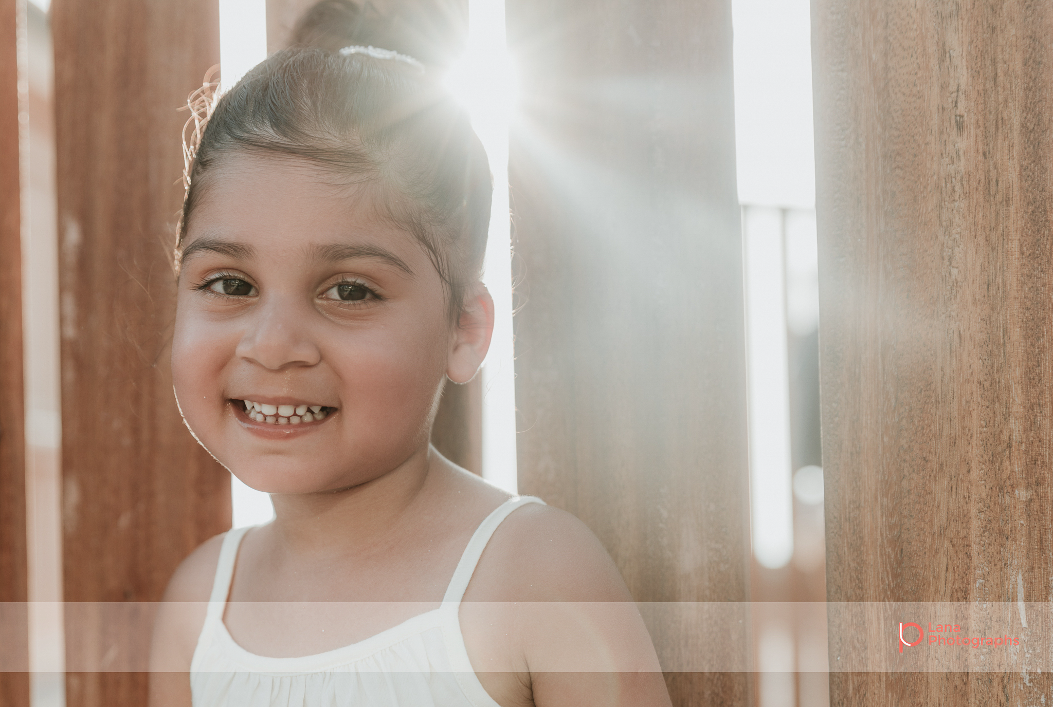 Lana Photographs Dubai Family Photography beach photoshoot portrait of young girl in the sun 